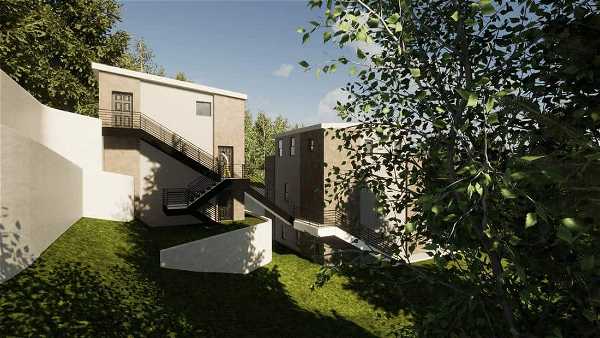 Modern hillside residential buildings with multiple terraces, stone facades, and external staircases surrounded by greenery and trees under a clear sky.